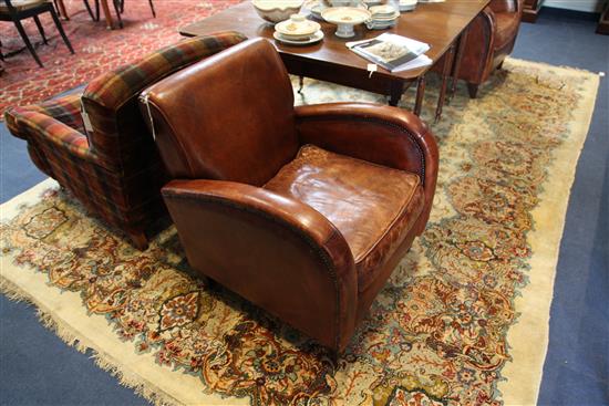 A pair of 1930s style brass studded leather club armchairs,